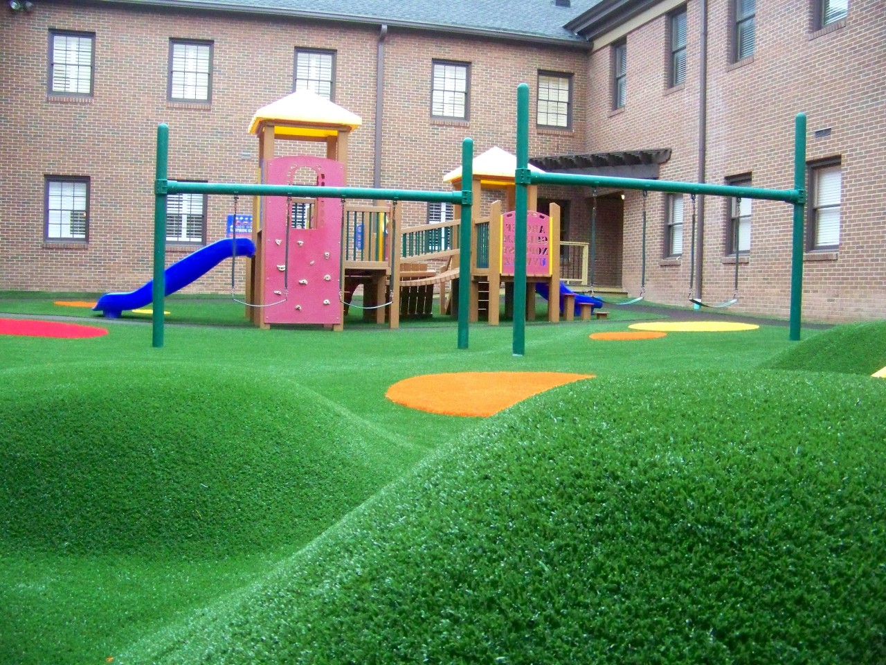 Hilly artificial turf playground by Southwest Greens of Michigan
